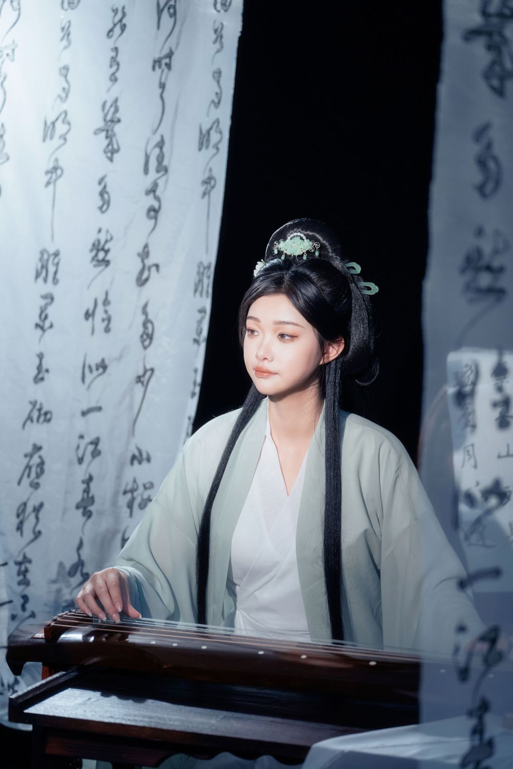 Serene and ethereal Hanfu photography of a woman playing Guqin surrounded by calligraphy scrolls, by Imagine Image Studio.