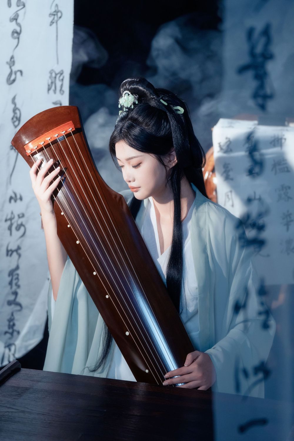 Serene and ethereal Hanfu photography of a woman playing Guqin surrounded by calligraphy scrolls, by Imagine Image Studio.