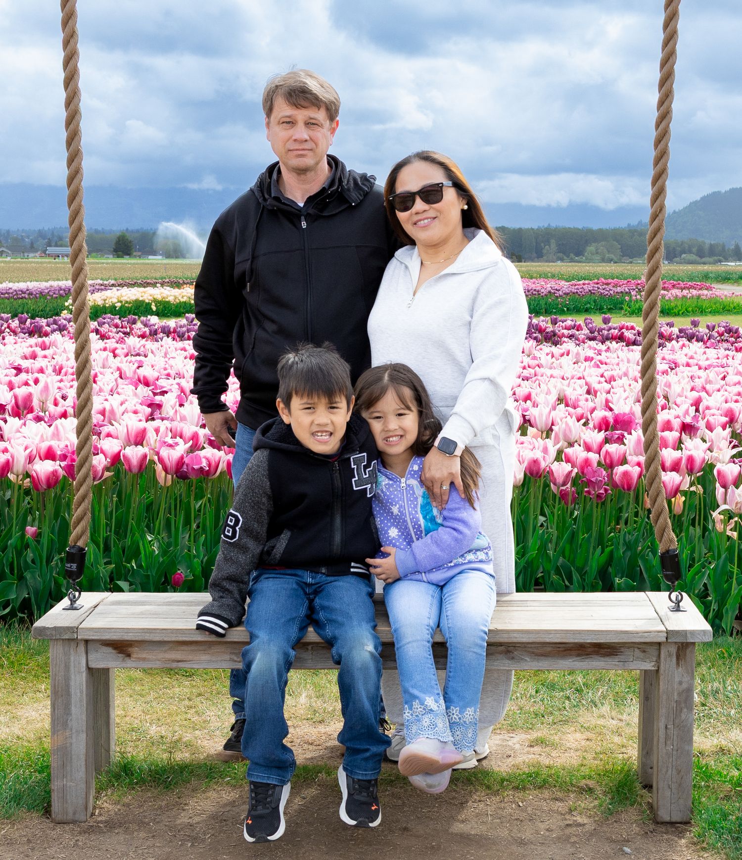 Family portrait in front of lake.
