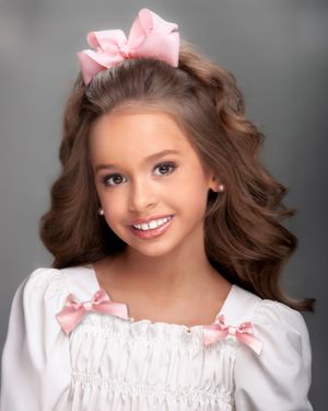 Queen Bee Photography with Frank Carnagio and Pink Bows Shein Kid Clothes with curly hair that makes pageant portraits stand out for a win