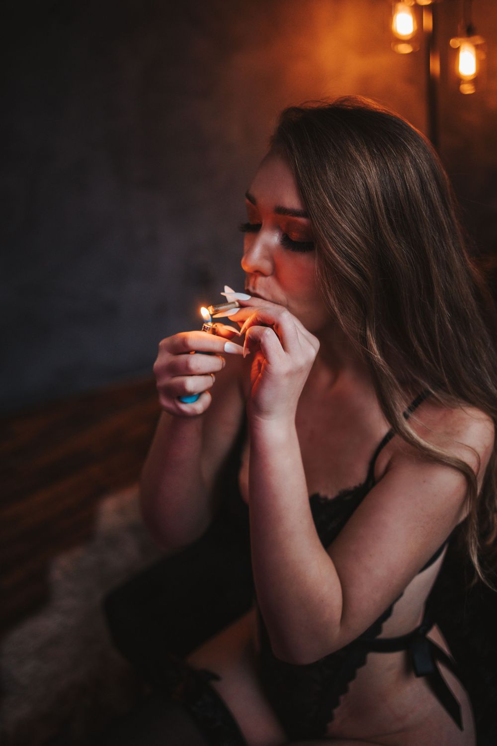 A sequence of moody artistic photos showing someone smoking in a dark setting with warm lighting.