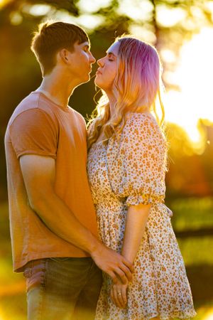 Romantic sunset portrait with couple in coordinating casual outfits. Geneva, Florida