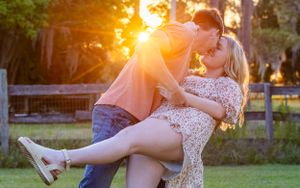 Romantic dip pose in sunset light with couple on grass.  Geneva, Florida