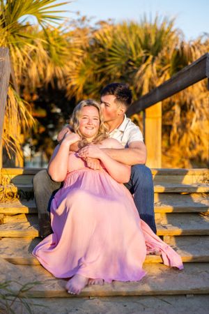 A romantic sunset moment on wooden steps surrounded by palm trees. Cape Canaveral, Florida
