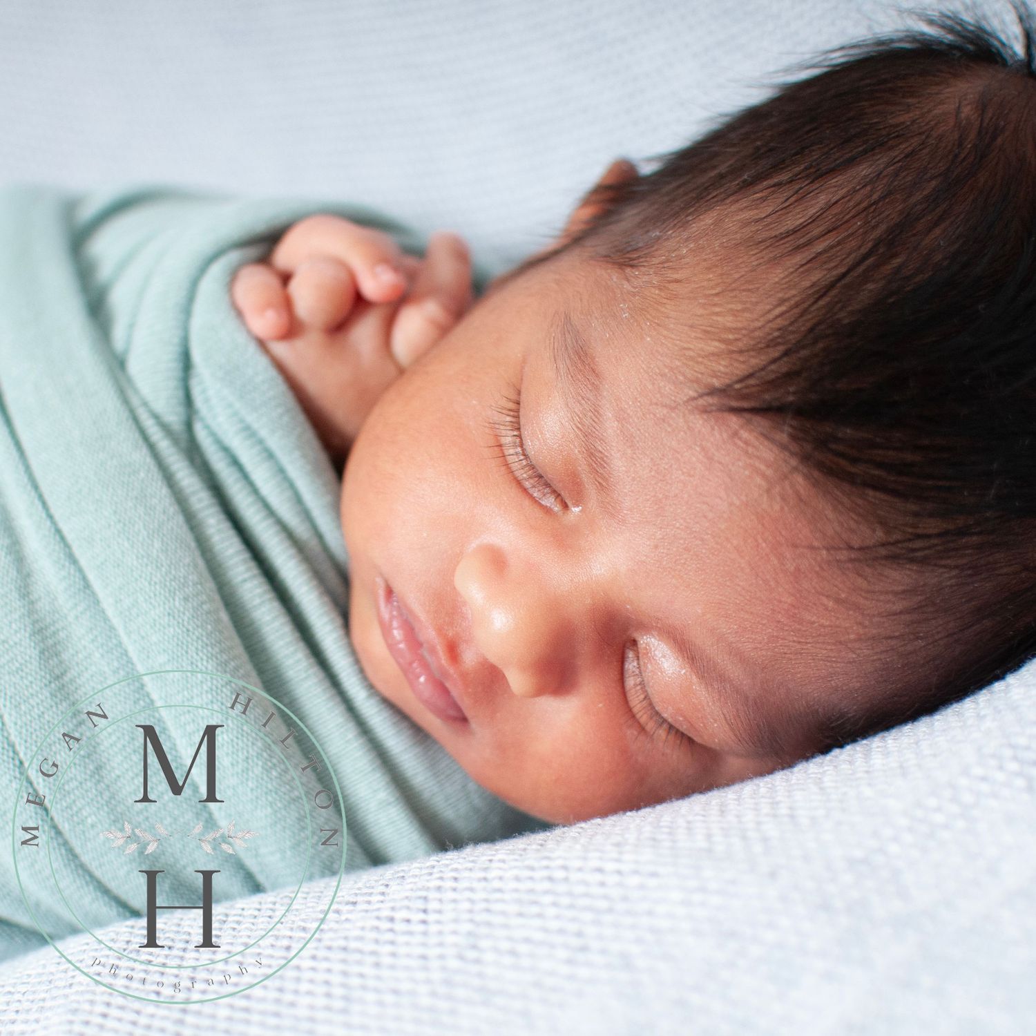 sleeping newborn in pastels