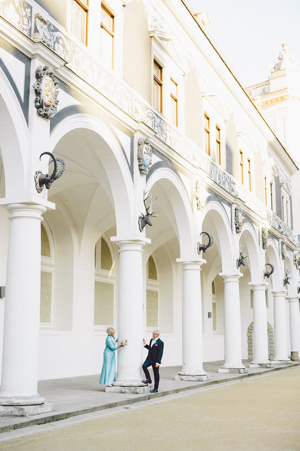 Historic colonnade with white arches and classical columns. Organized wedding by MyCastleWedding | Dresden.