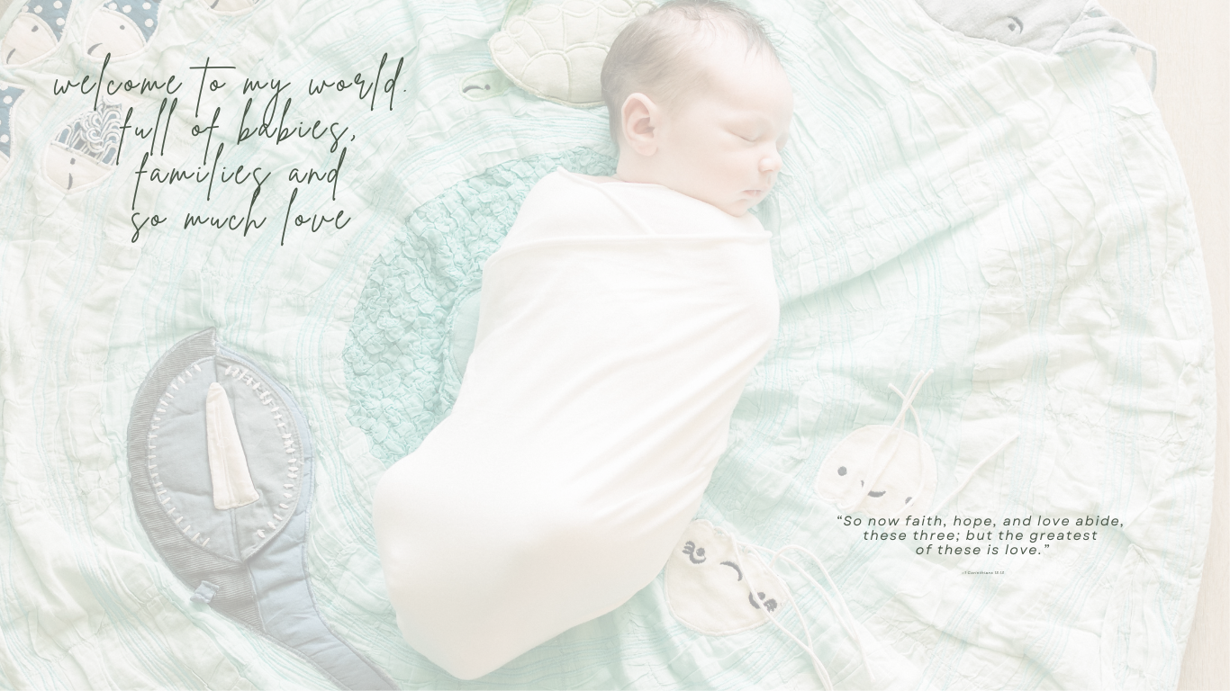 Newborn baby sleeps swaddled in white on mint green background with sailboat artwork.