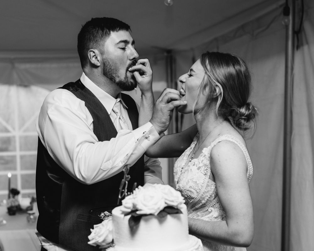 Professional photo of a bride and groom eating cake