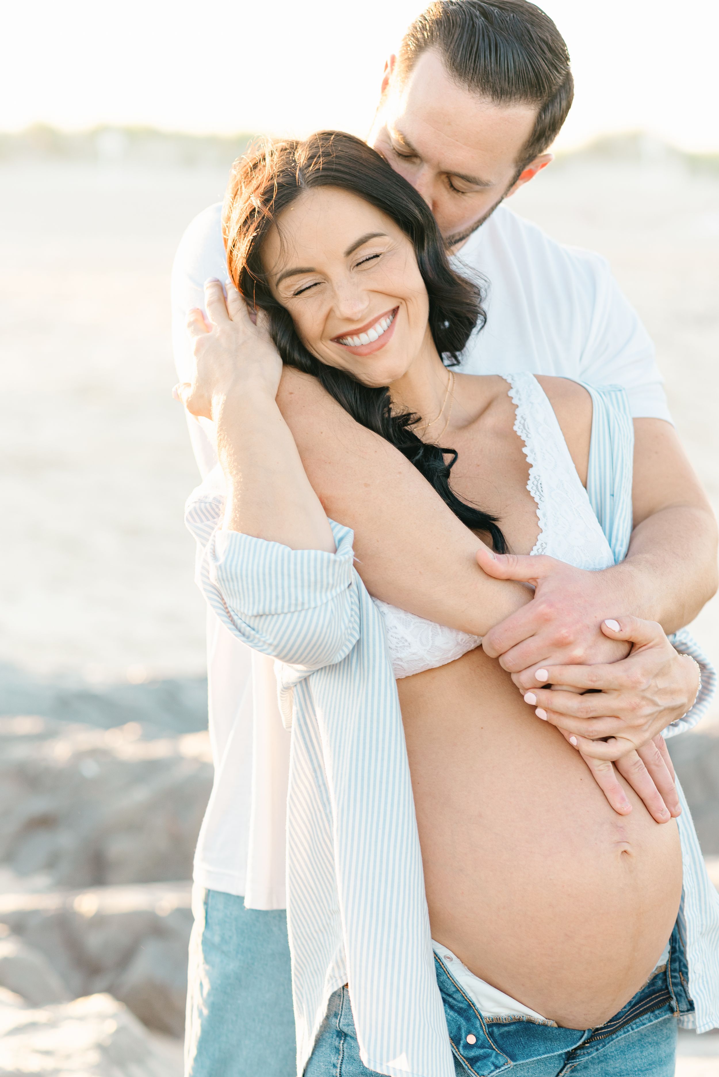 north carolina couple comes back to new jersey to capture maternity photos on seagirt beach.
