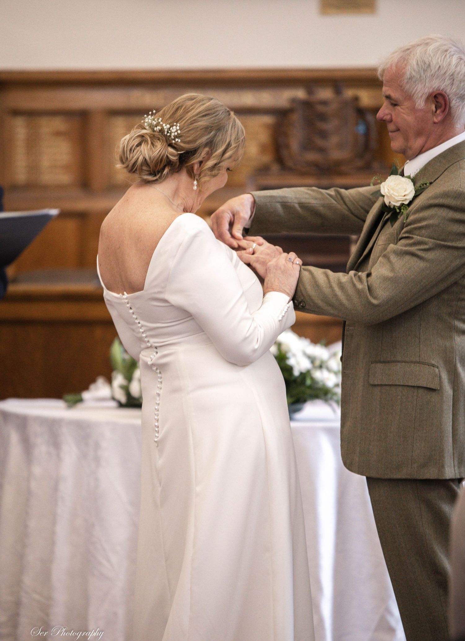 Couple exchange rings at wedding