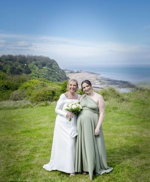 Bride and maid of honour on the cliffs