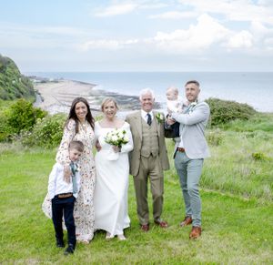 Bride and groom wirh family on the cliffs