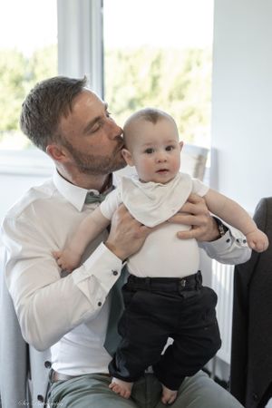 Young family at a wedding