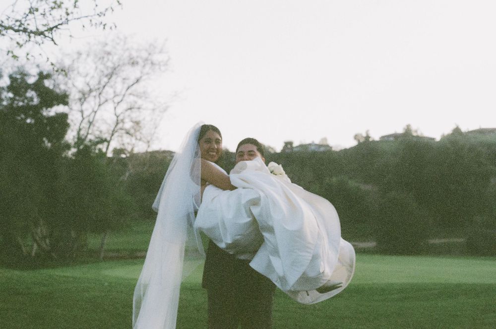 Ethereal bridal portraits captured in a dreamy outdoor setting with flowing white fabric.