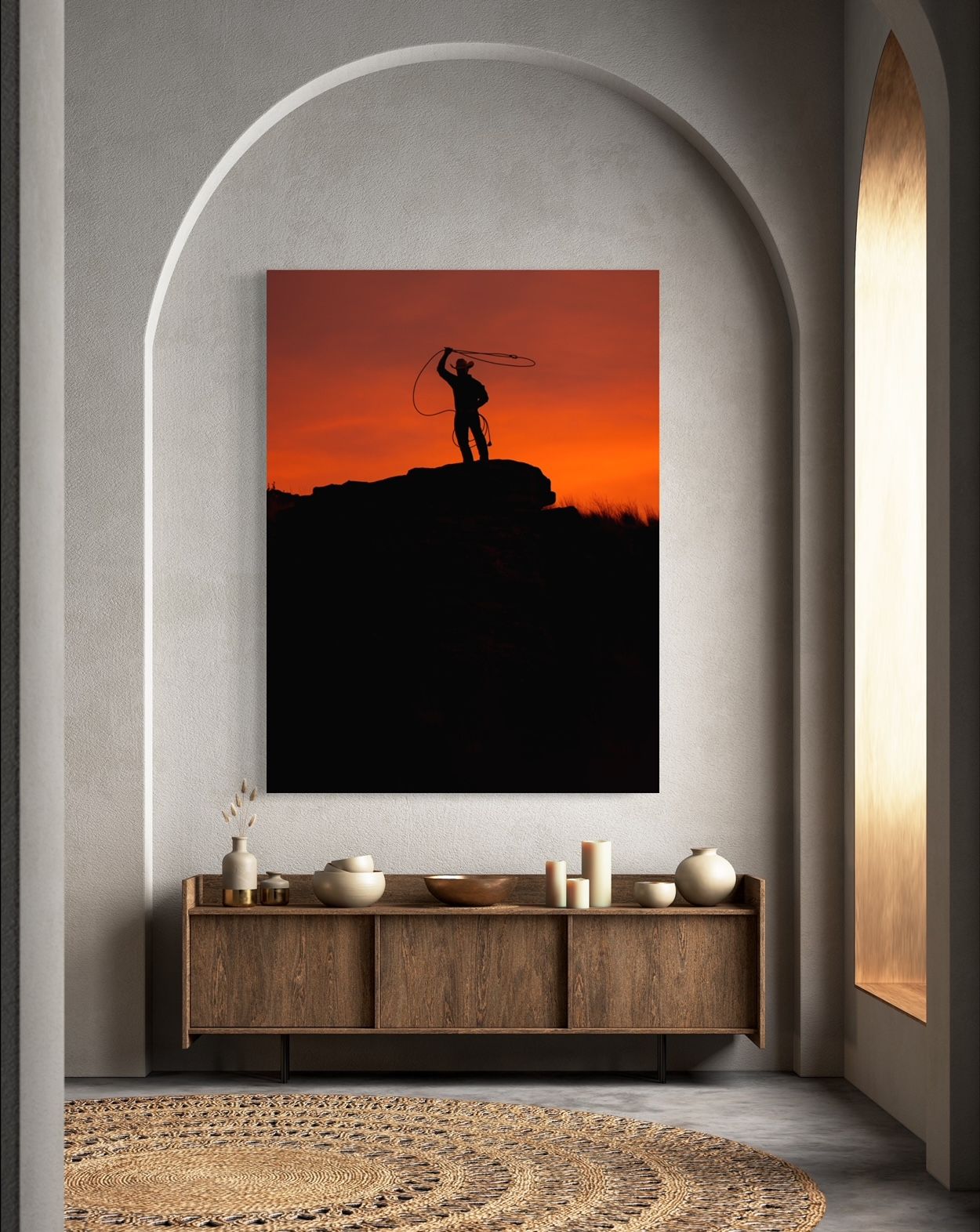 Dramatic silhouette of figure against orange sunset displayed in modern arched room setting.