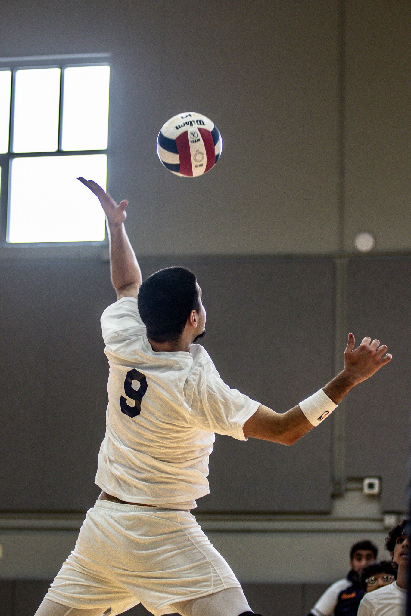 CPSA's #9 striking a volleyball.