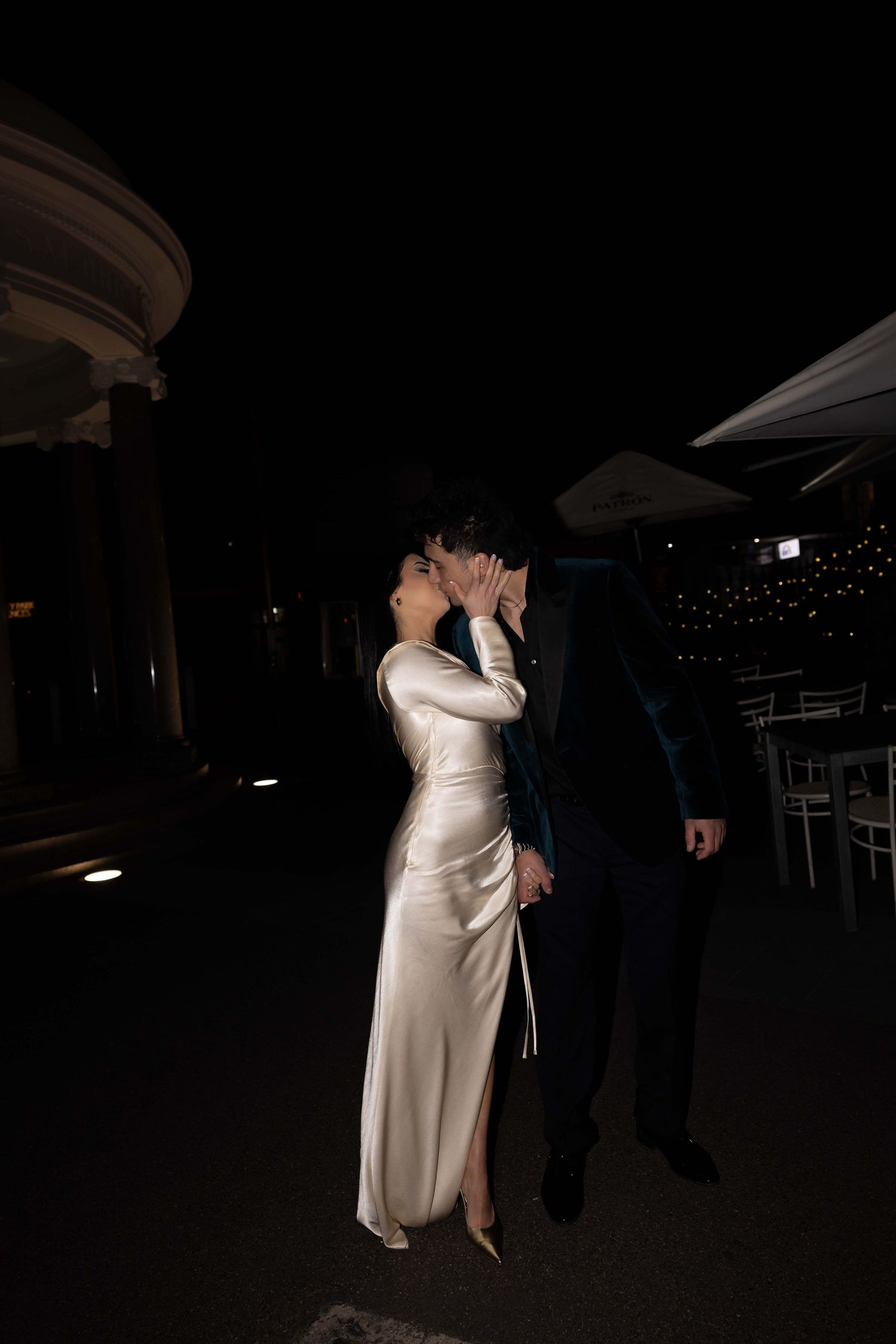 A romantic black and white photo series showing an intimate dance between two people in formal attire.