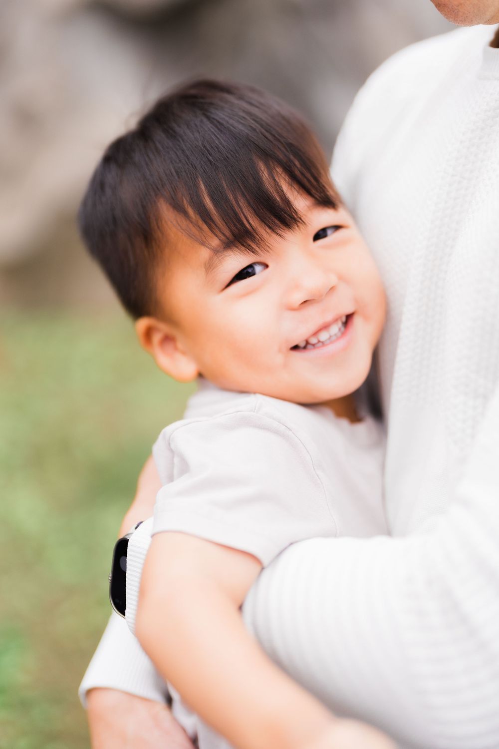 kid smiling in dad's arm at Lin An Tai Historical House and Museum