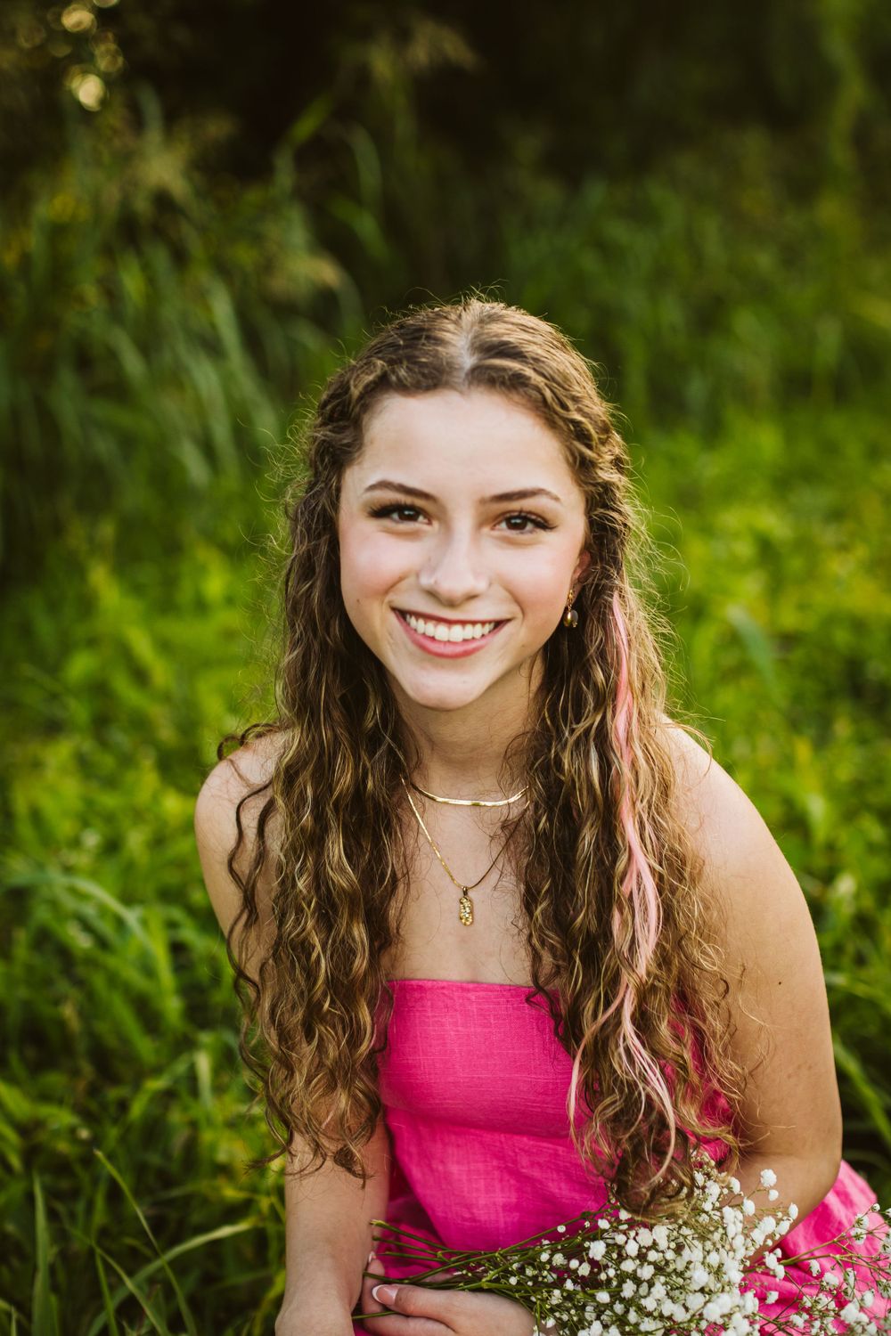 senior session female student pink dress flowers