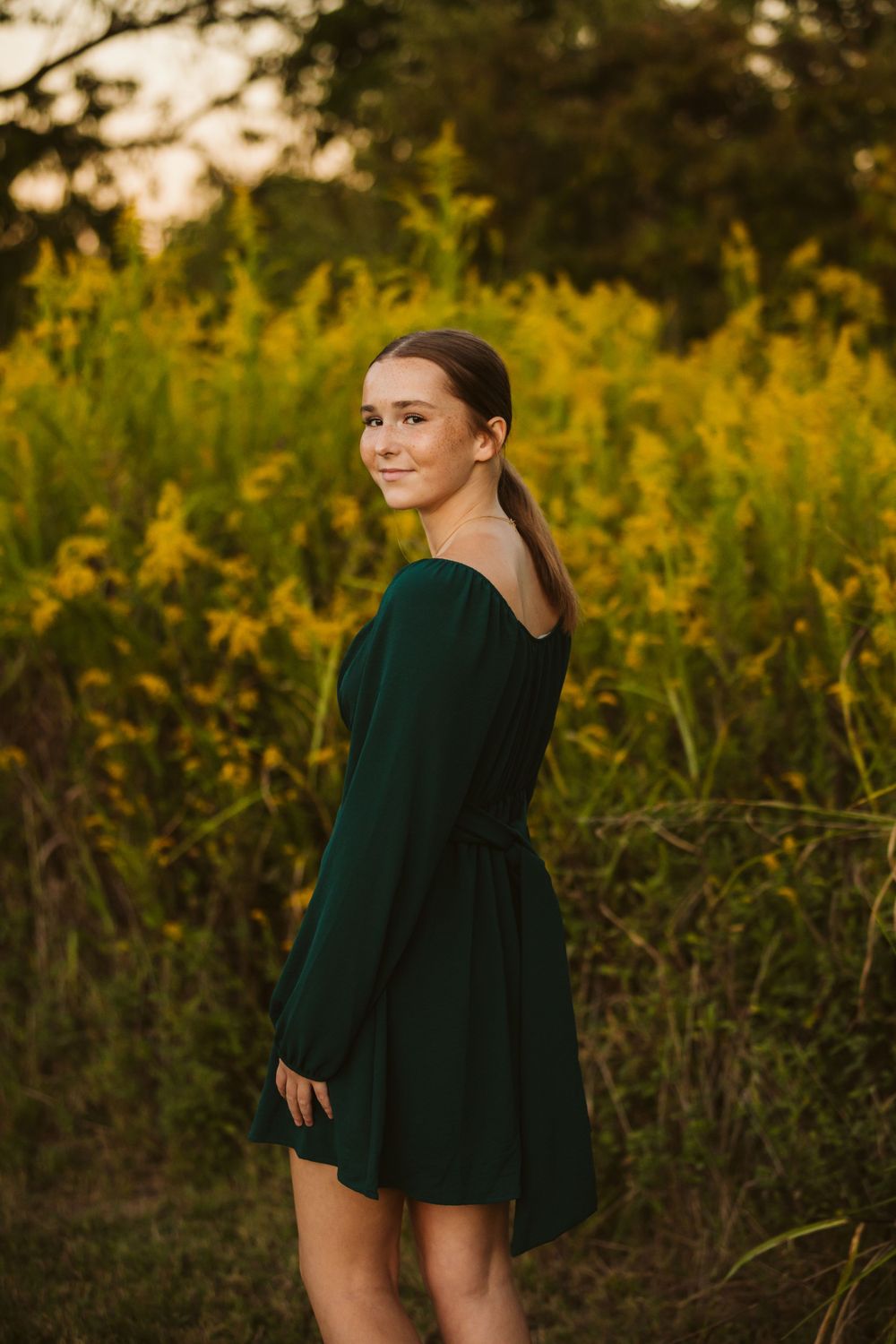 senior session female student tall grass