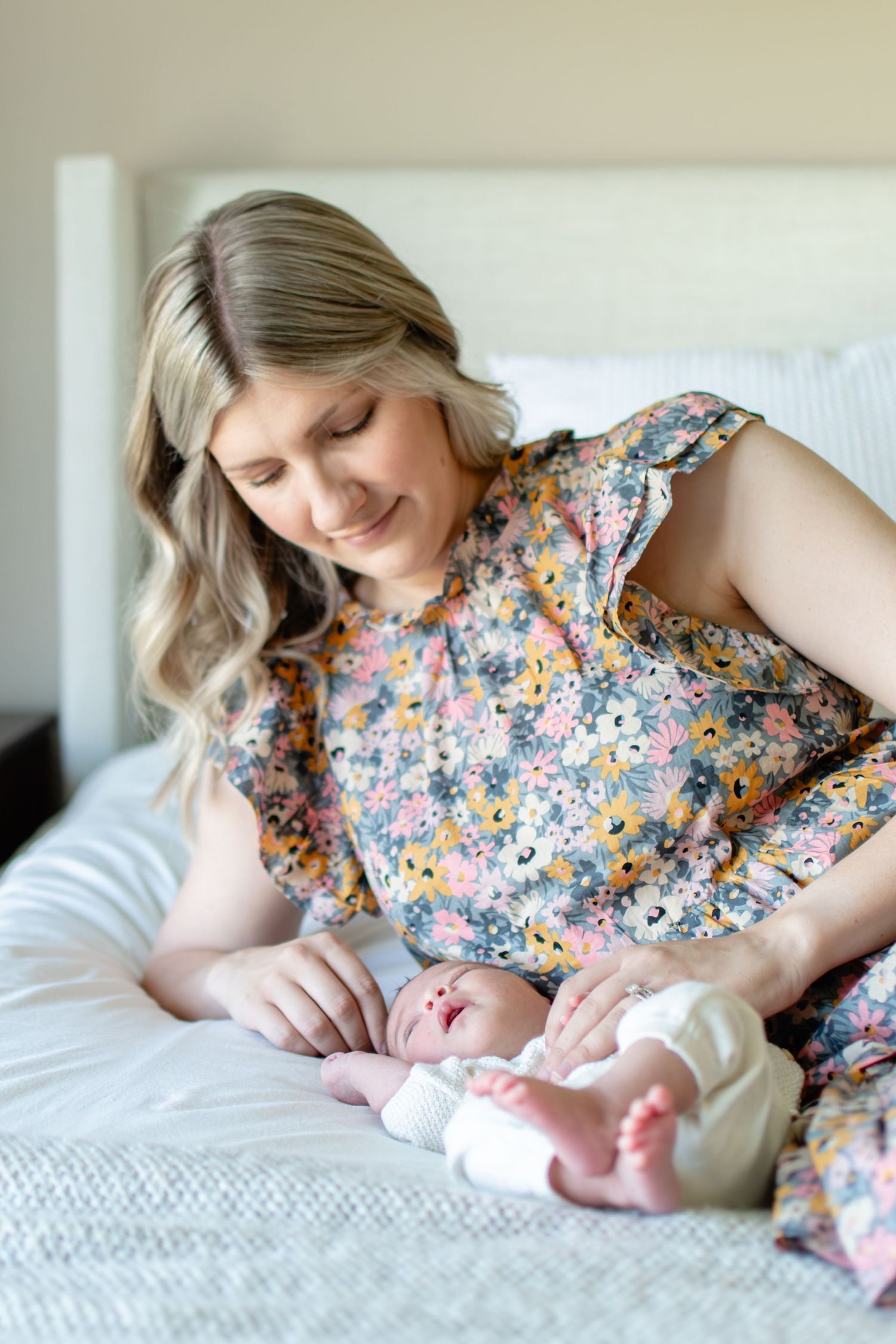 Baby girl relaxes as mom looks on adoringly in their Winston-Salem home.