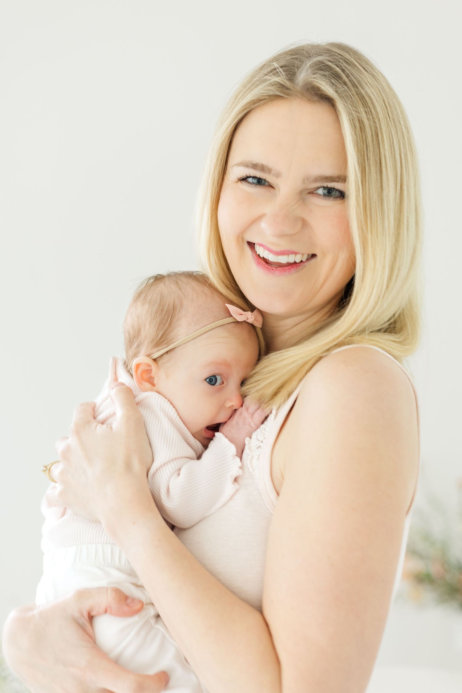 Intimate portrait series showing maternal bonding moments in soft natural light.