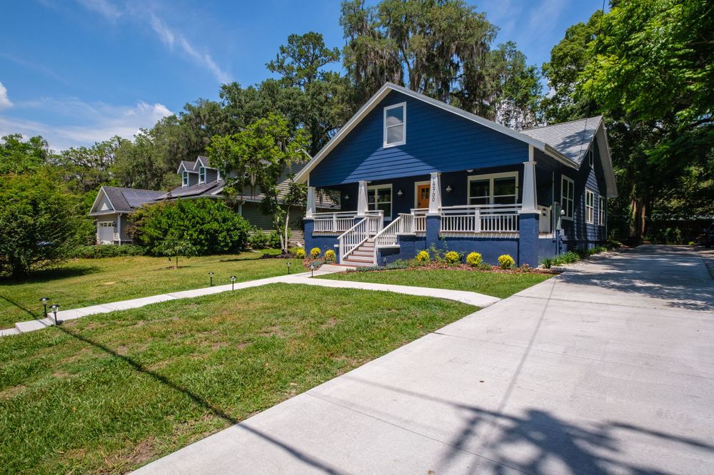 Exterior real estate photograph of a blue house in Gainesville, Fl.