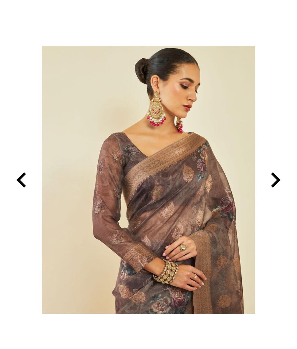 Close-up of brown floral saree styling with statement jewelry and elegant makeup.