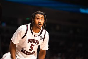 South Carolina Gamecocks basketball player wearing number 5 white jersey looks up during a college basketball game.