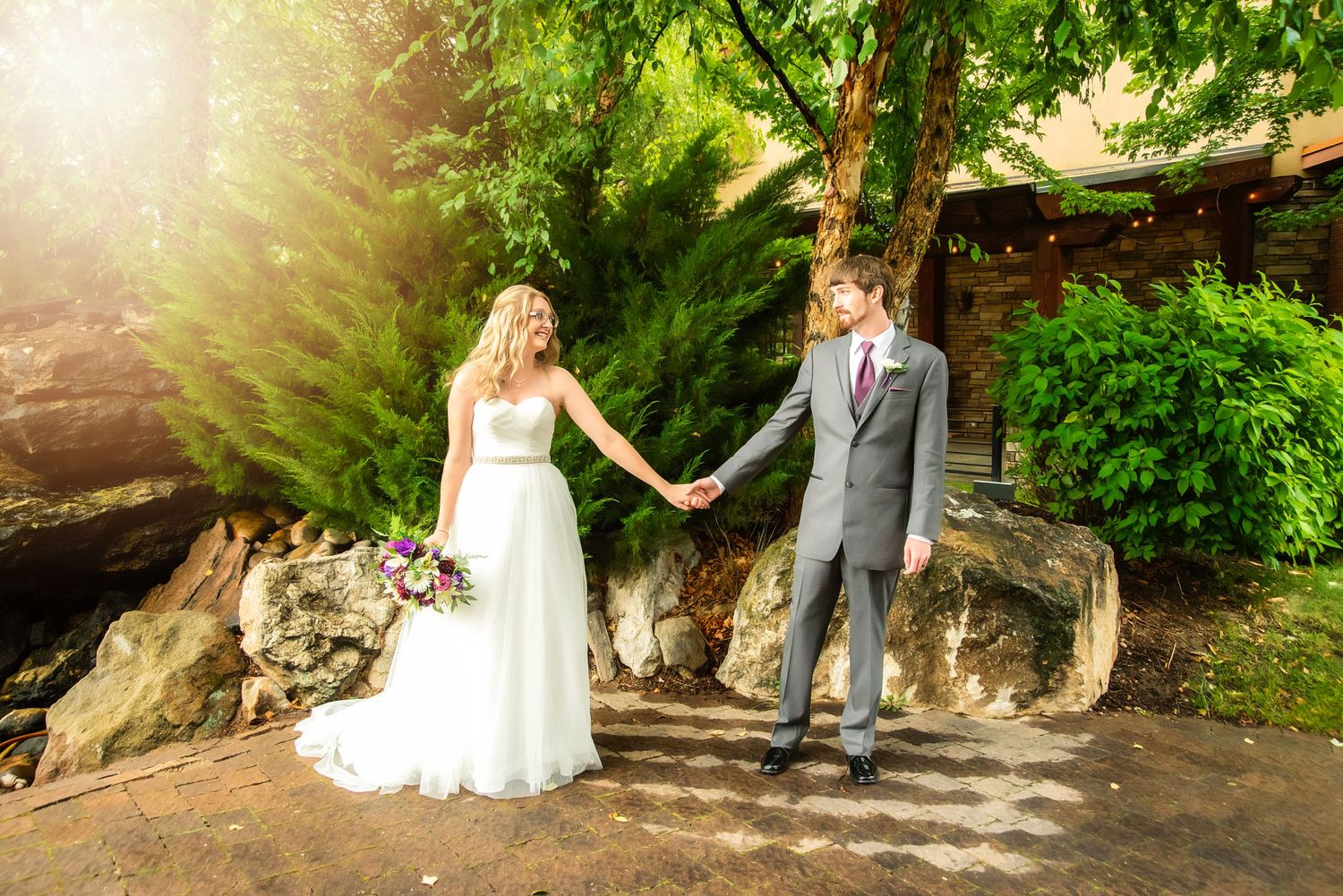 Bride and groom posing at their wedding at Swiftwater Cellars in Suncadia for wedding photography