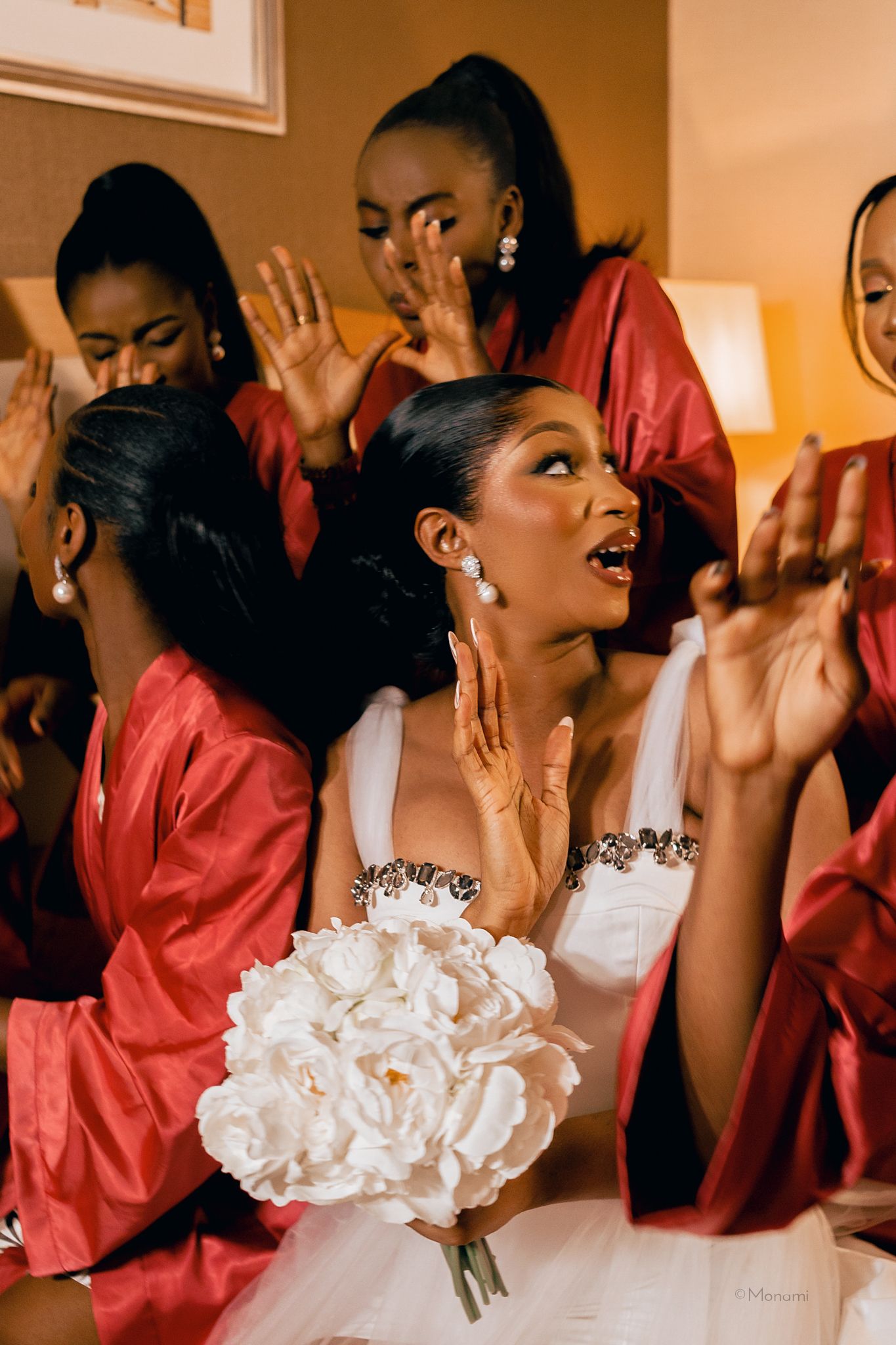 An editorial wedding image of a bride and her bridesmaids captured by Monami Photography
