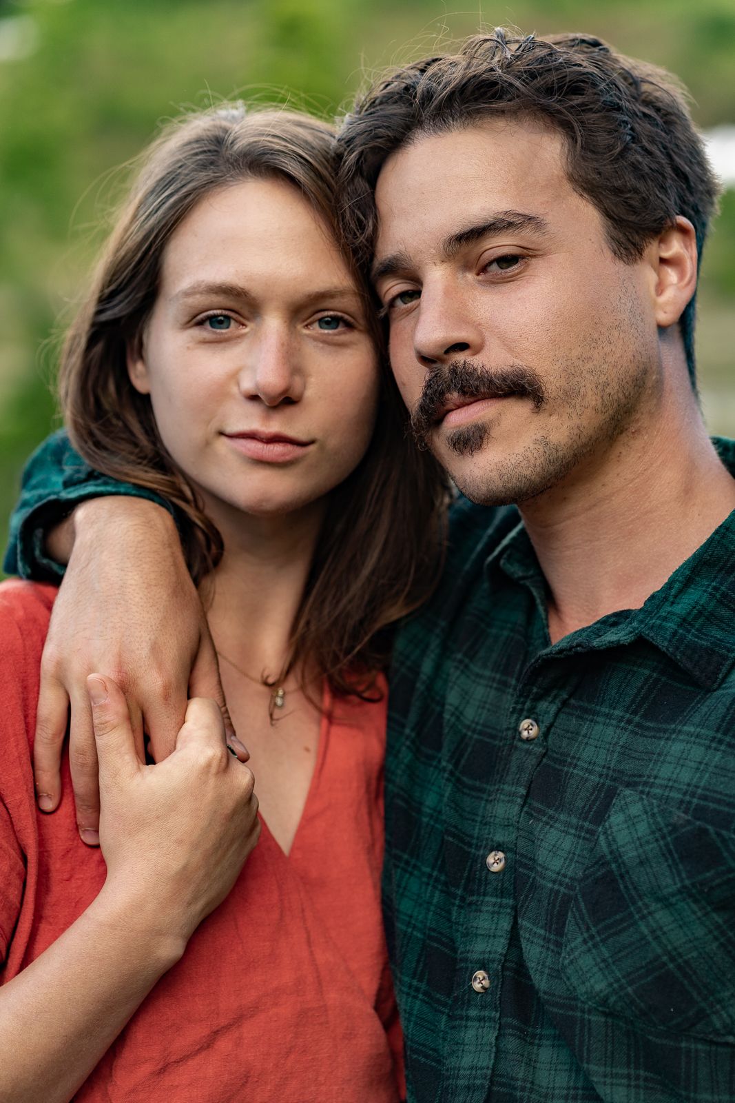 family, professional, photography, outdoor scenic photo session husband wife love hugs kisses flowers greenery forest washington engagement
