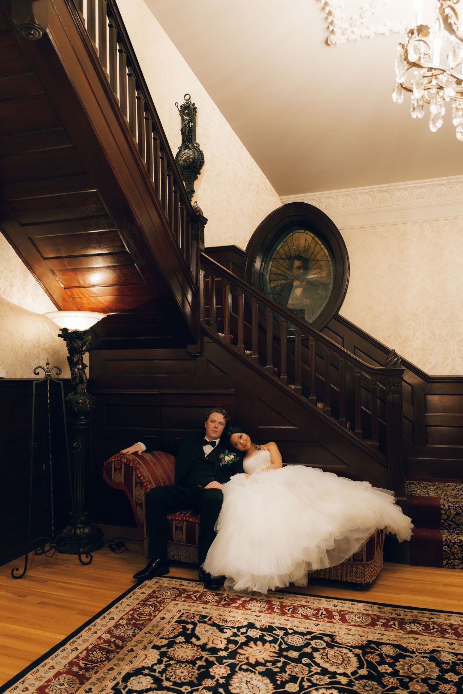 A tender moment shared between newlyweds under a wedding veil.