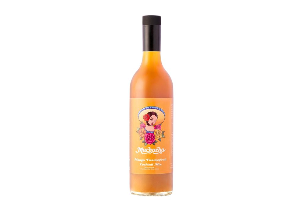 A bottle of orange-colored Mexican hot sauce with a cartoon character on the label.