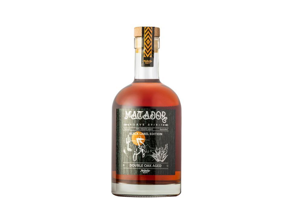 Three bottles of premium whiskey displayed on a white background showing different angles of their distinctive designs.