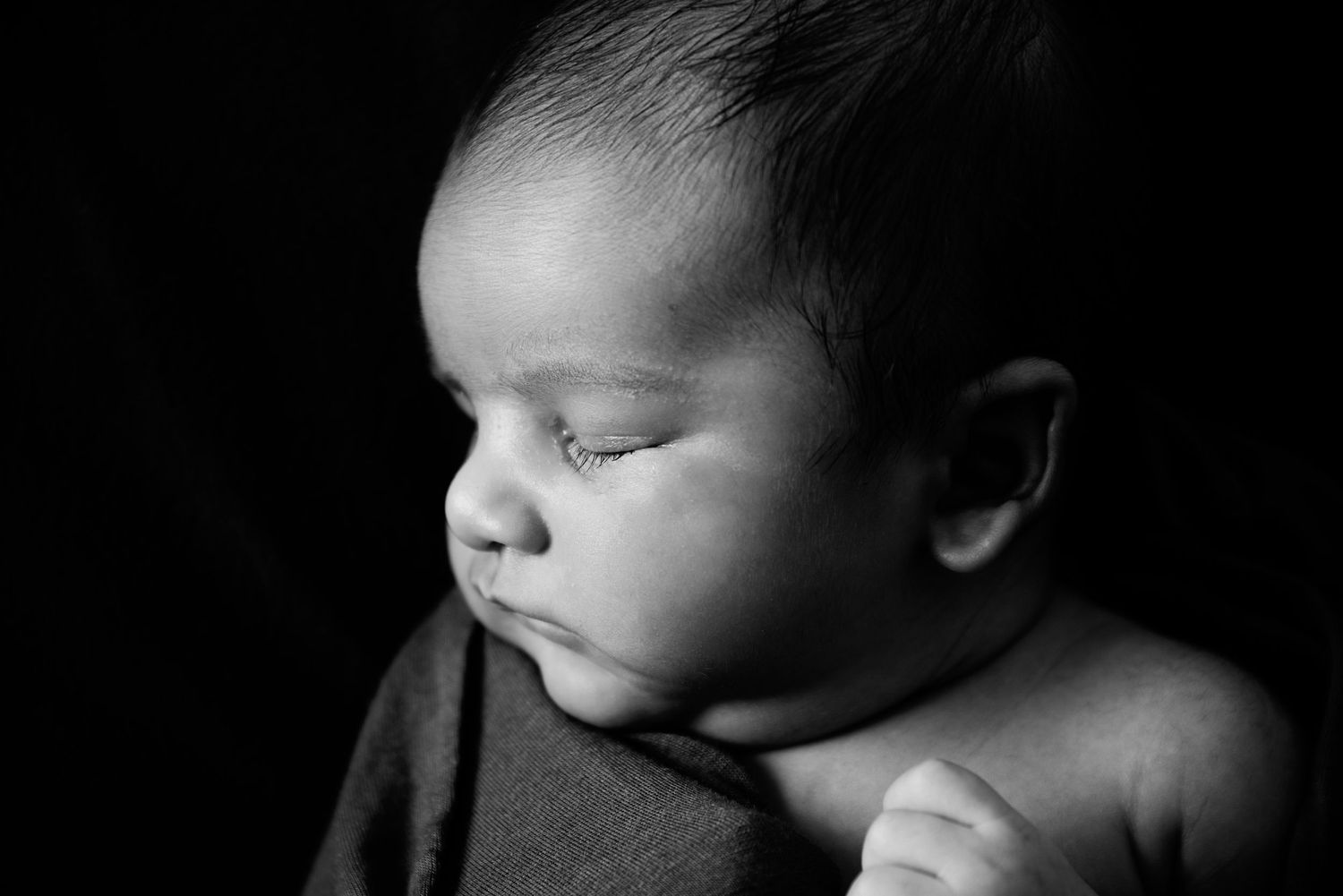 Specialist baby photographer Gold Coast capturing tiny newborn details and lashes.