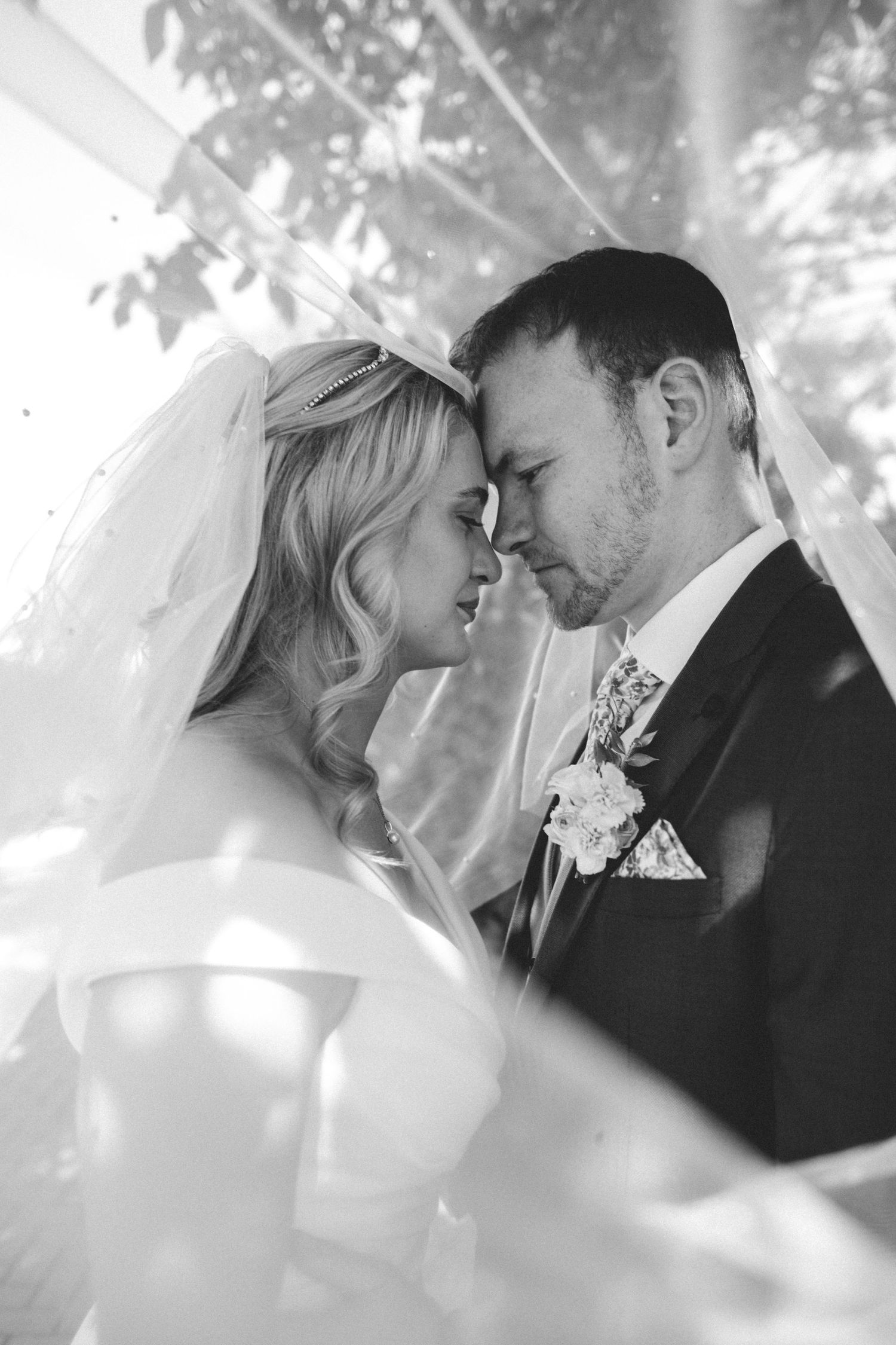 Groom hugging bride romantic