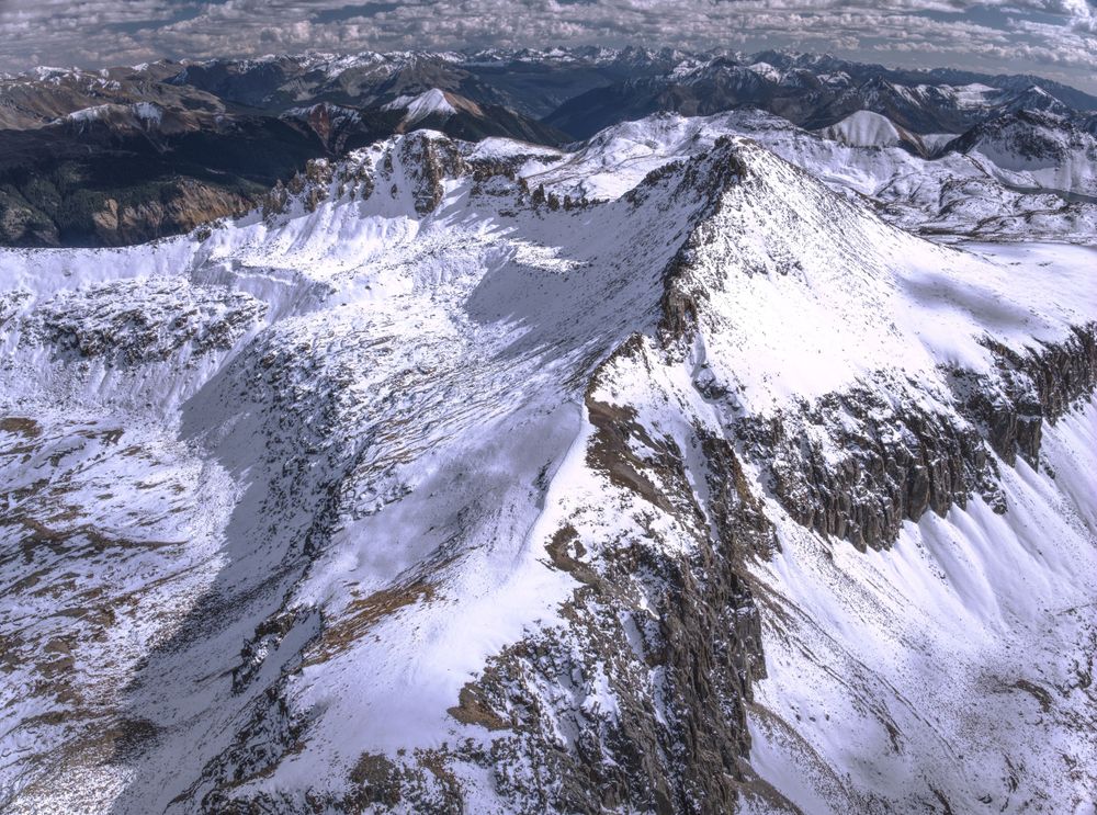 Snowy peaks of a mountain range.