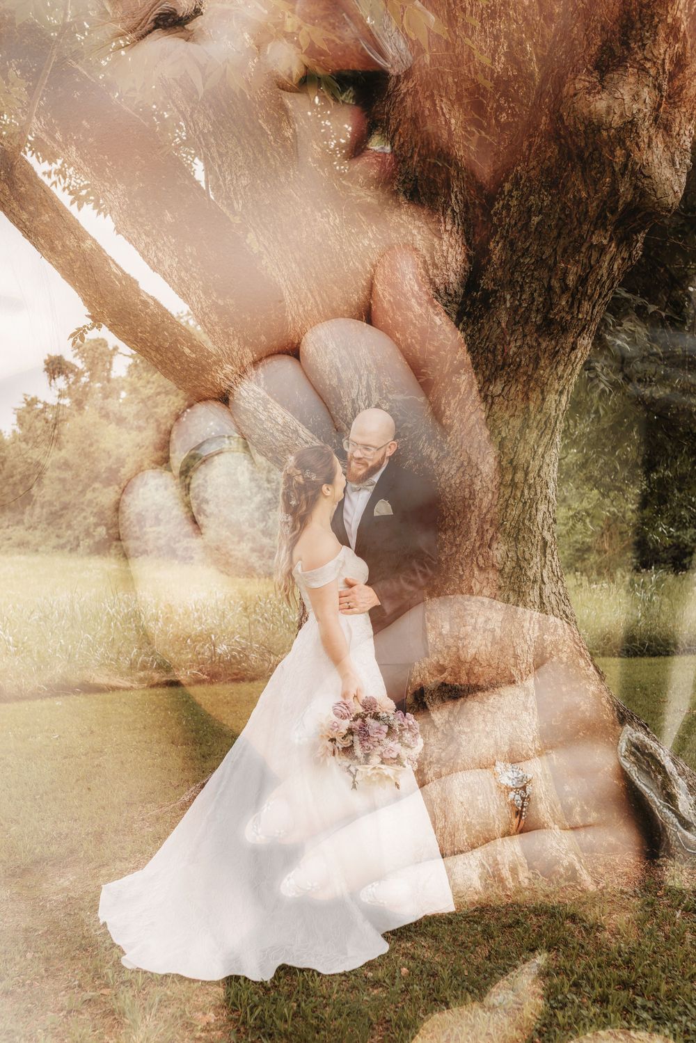 Artistic double exposure wedding portrait blending bride and groom with a tree and clasped hands.