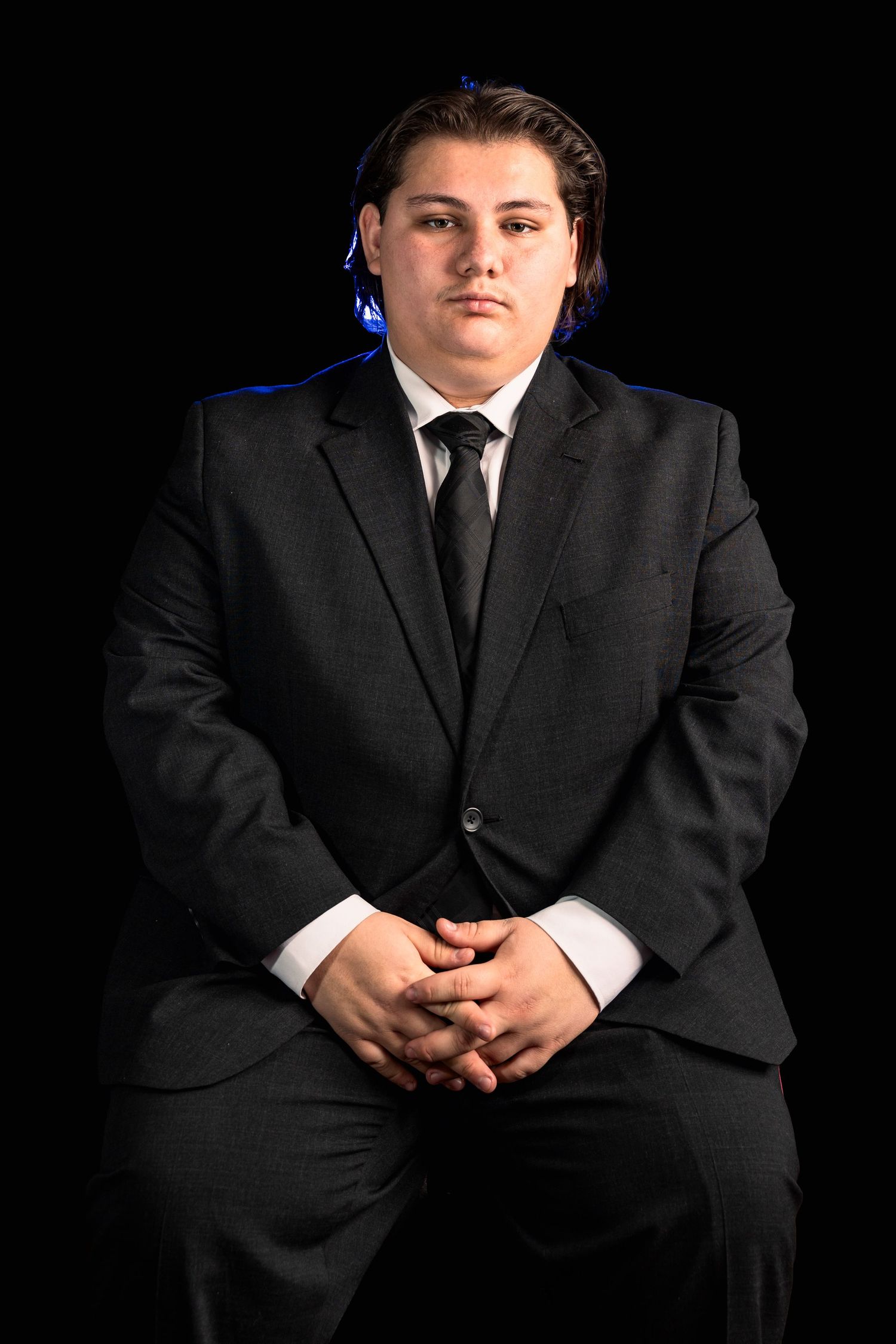 Sitting photo of Tate Butcher, serious