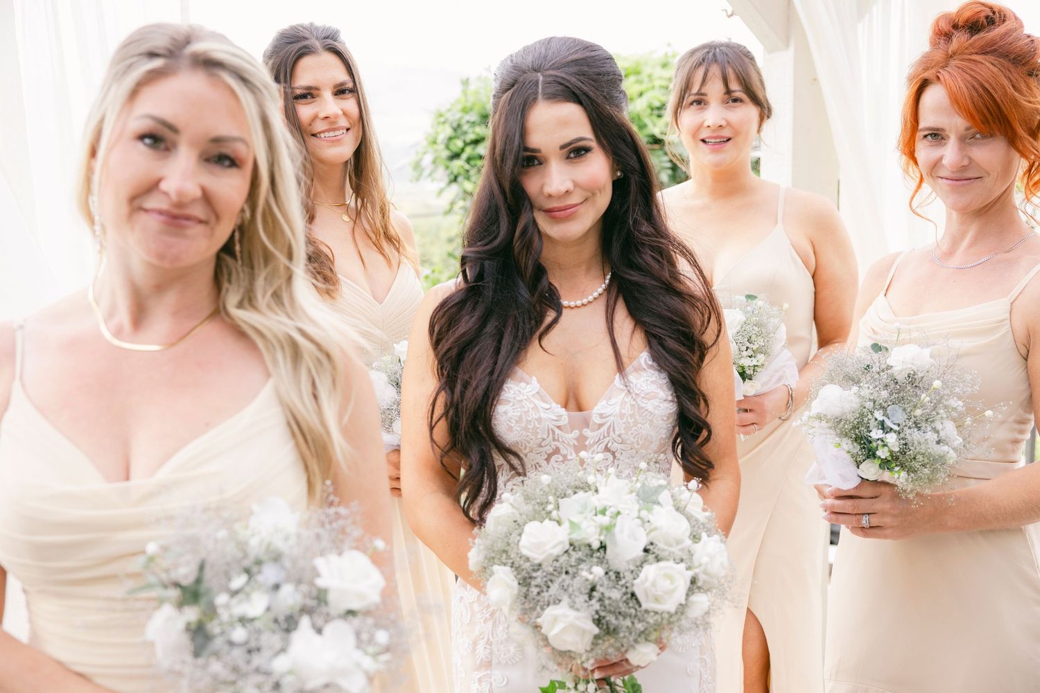 Bridesmaids laughing while getting ready at a Kelowna bridal suite