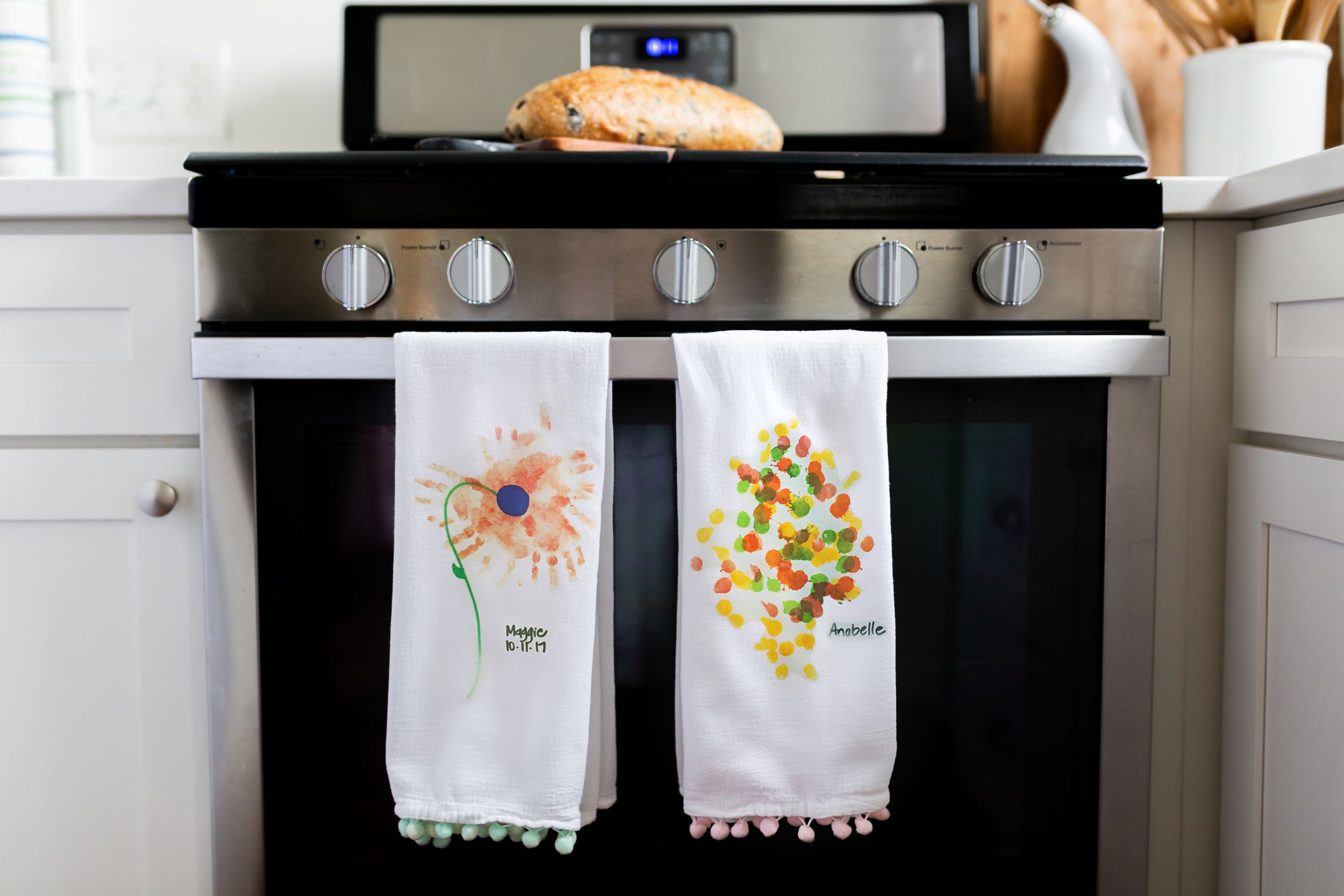White kitchen stove with decorative tea towels featuring floral embroidery designs.
Commercial Photography
HGTV