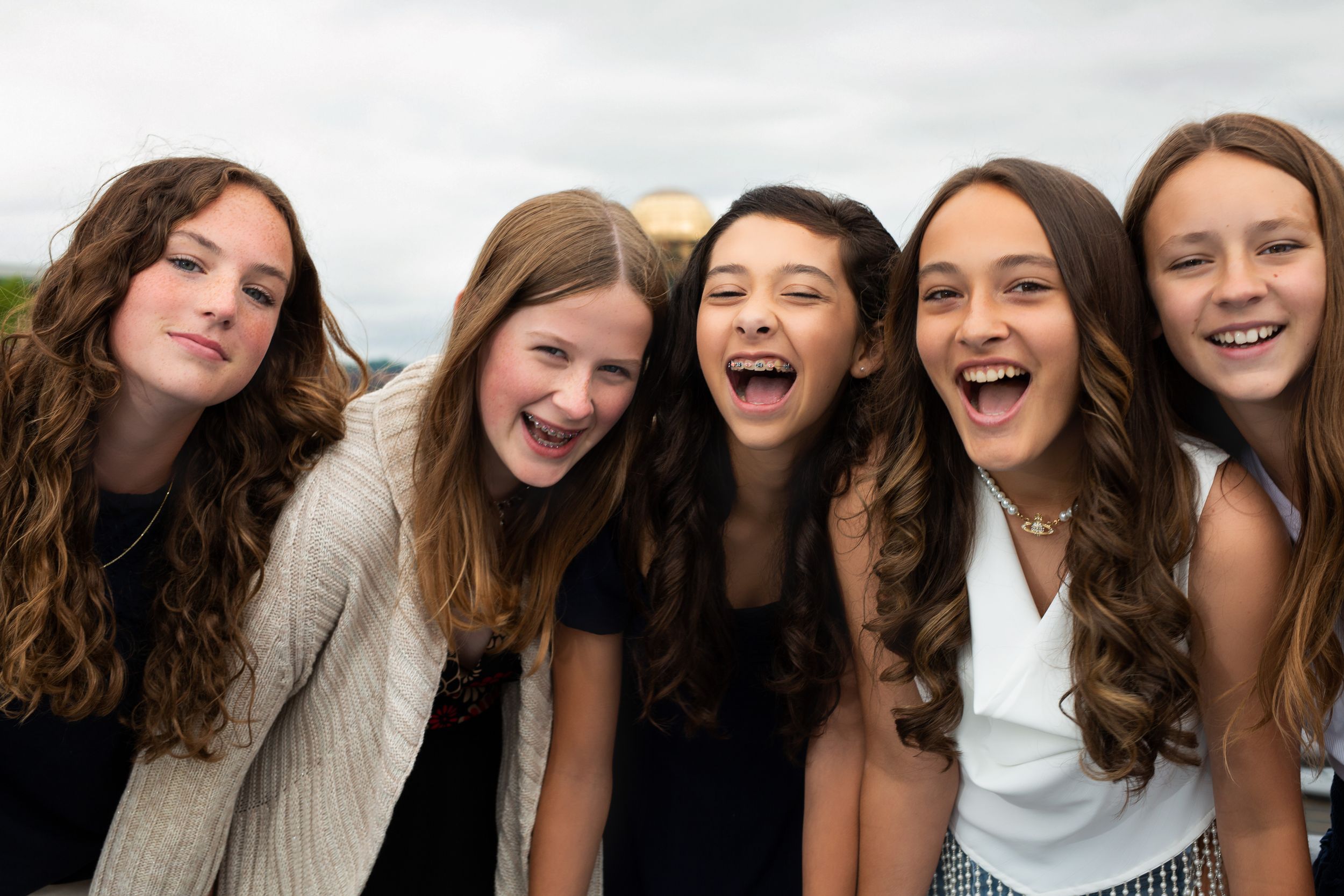 Close-up candid portrait of friends sharing joyful moment together.