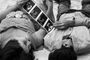 A sequence of black and white photographs showing someone lying down in different sleeping positions on a bed.