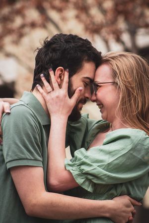 A romantic sequence of photos showing a couple in green shirts embracing and sharing intimate moments together.