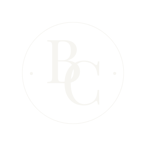 Minimalist white circular logo design with BC initials.