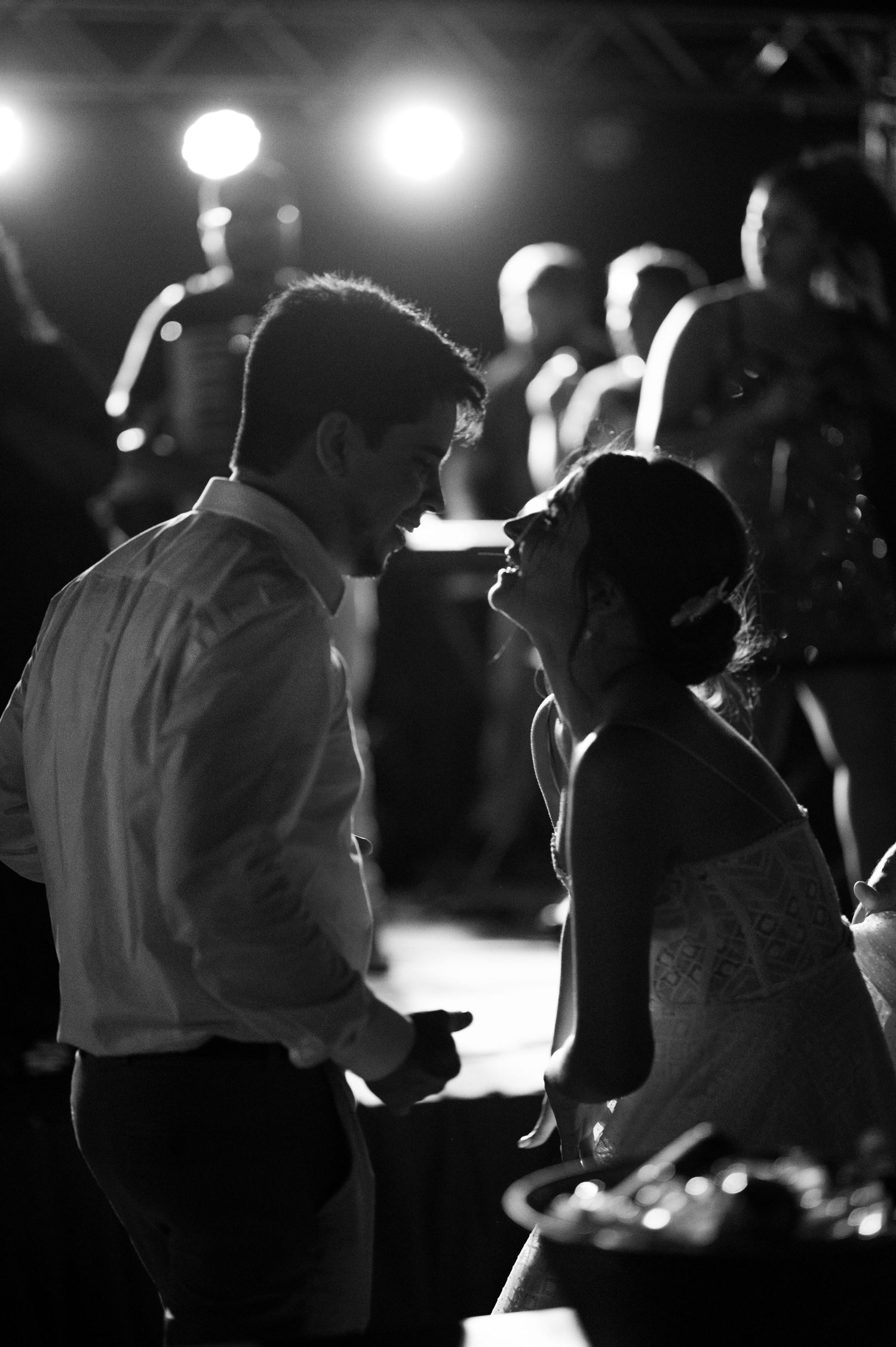 Intimate black and white dance moment captured during wedding reception.