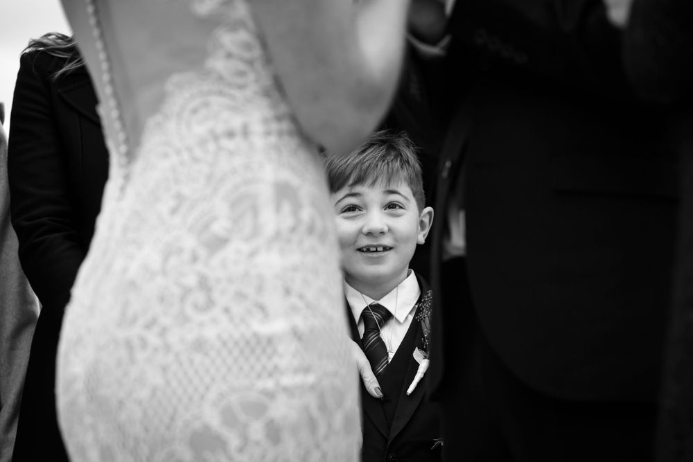 Emotionnal B&W photo of a young kid during an elopement wedding ceremony in Paris, by Julien Paris photography