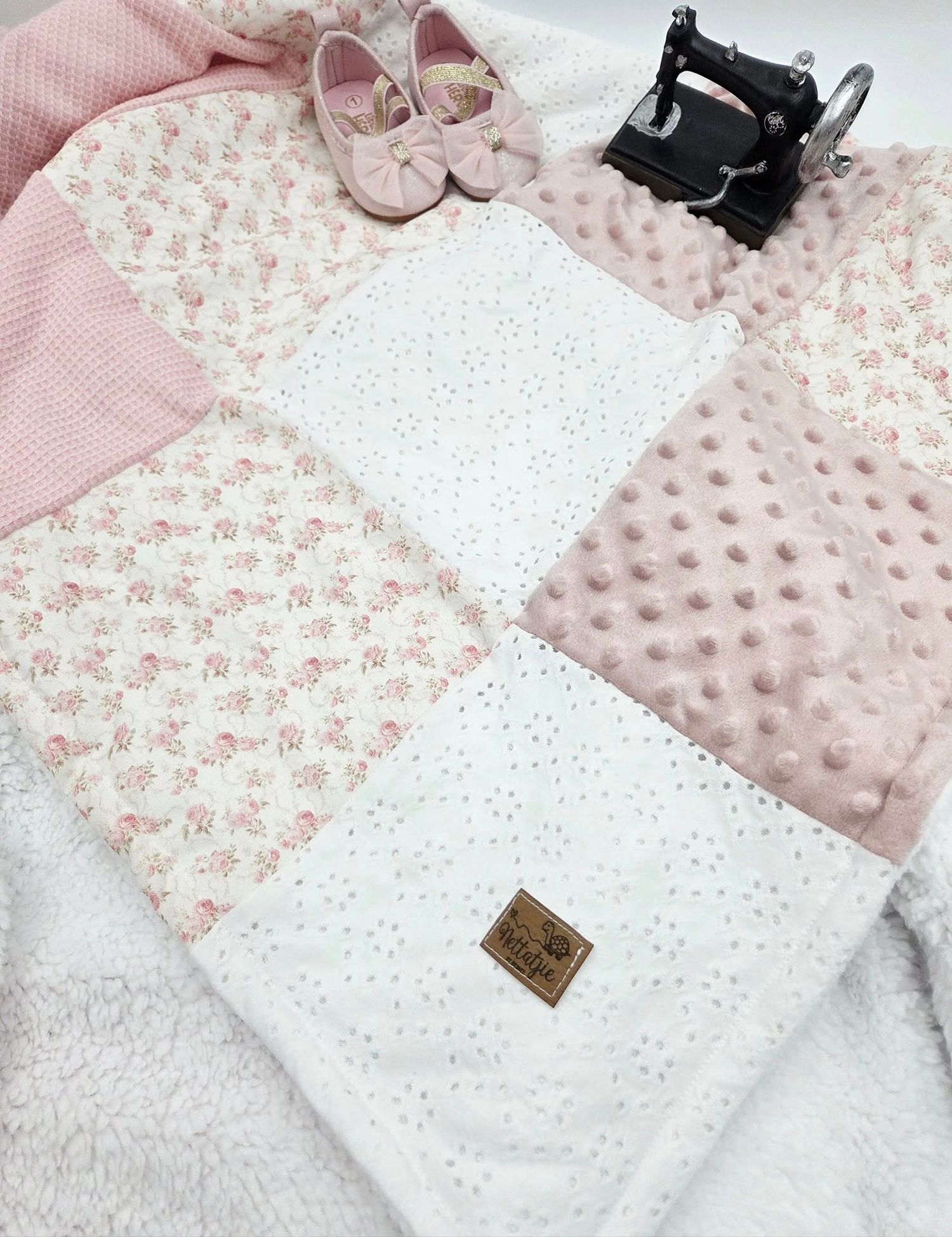 Pink and white baby blanket set with minky dot texture and eyelet lace details.