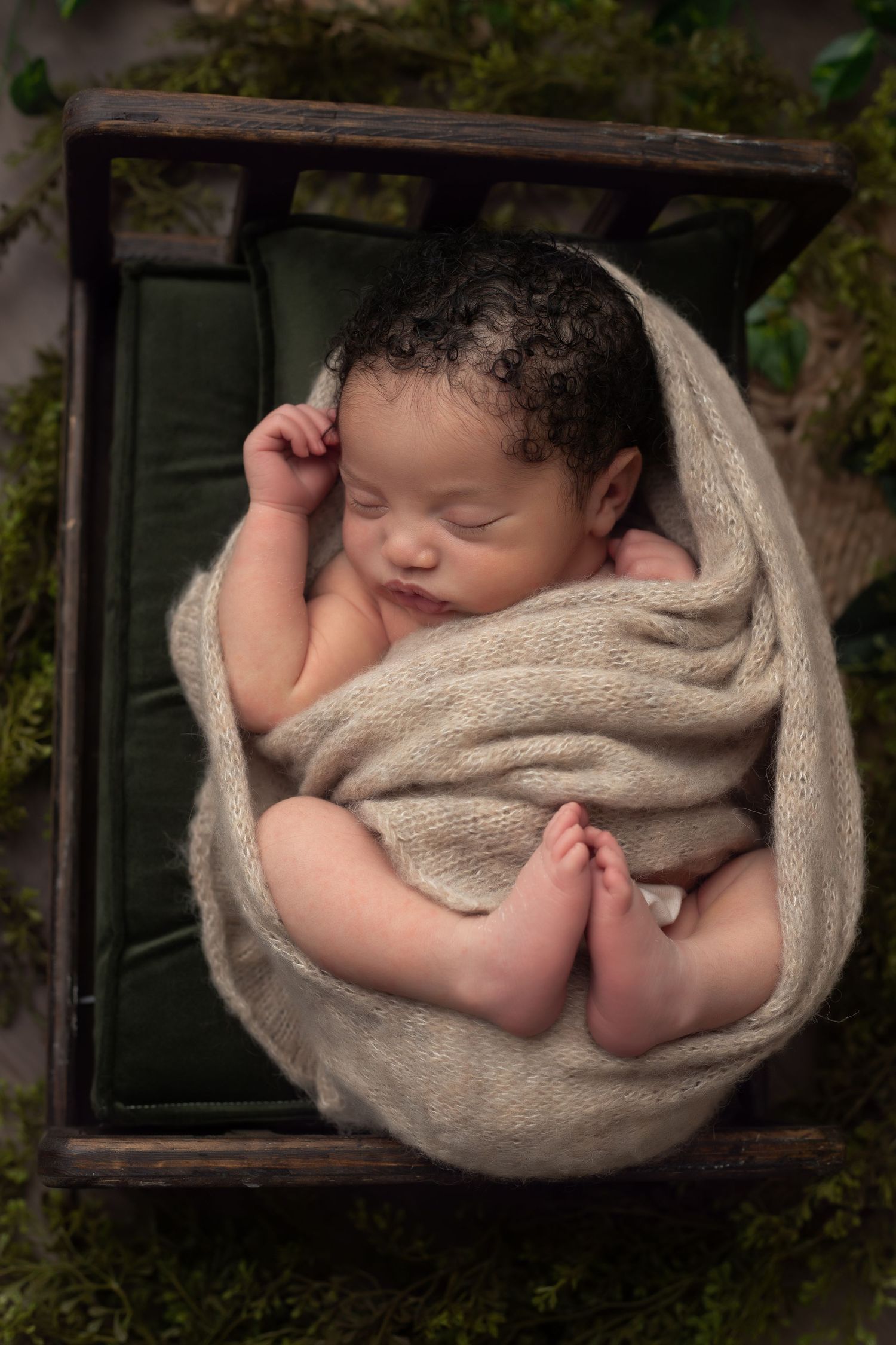 Image of sleeping newborn baby boy, with little fit out.